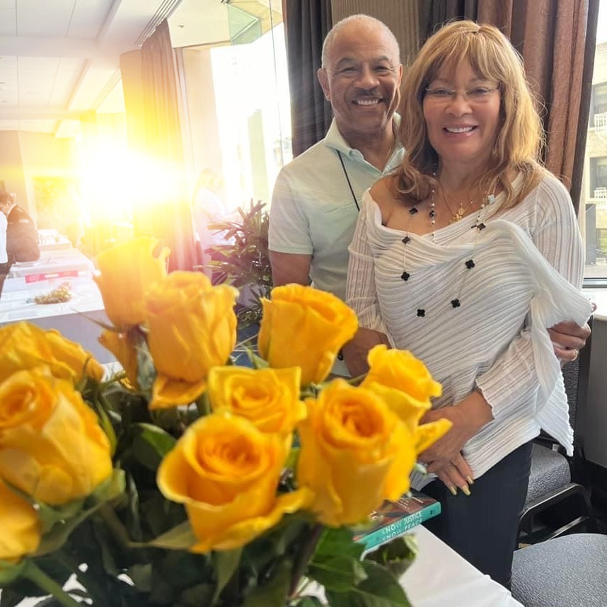 Dr. Gene Egerton & Dr. Deborah Egerton at the 2023 IEA Conference, San Francisco celebrating her Keynote address and her book "Know Justice Know Peace"